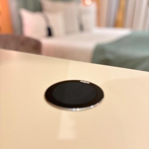 a black object sitting on top of a table at Hotel Clipa in Drobeta-Turnu Severin