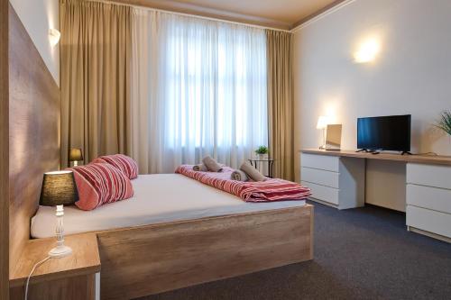 Postel nebo postele na pokoji v ubytování Stodolní Apartment
