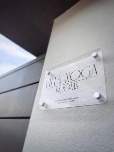 a box with a sign that reads milka nova rooms at Villa Noga Rooms in Selargius
