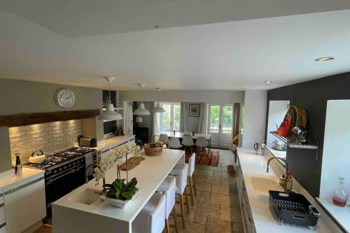 a large kitchen with a large island in the middle at Large 4 bed house in Malmesbury, great for big families in Malmesbury