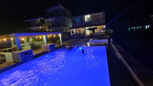 an overhead view of a swimming pool at night at TOHO NIAS in Telukdalam