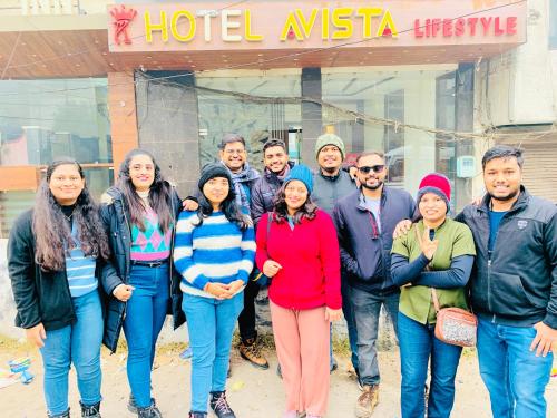 a group of people standing in front of a hotel institute at Avista Hotel in Amritsar