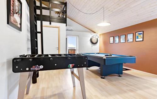 a billiard room with a blue table in it at Stunning Home In Strandby With Wifi in Strandby