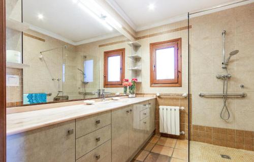 a bathroom with a double sink and a shower at Nice Home In Jávea With Wifi in Jávea