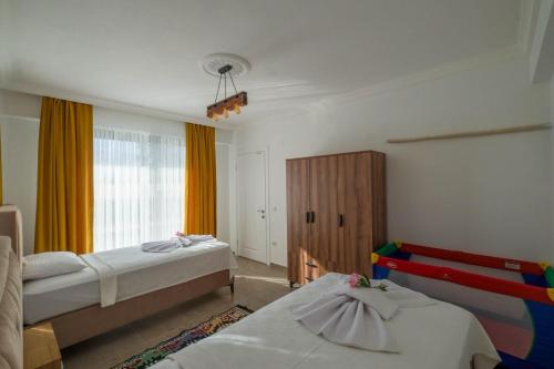 Postel nebo postele na pokoji v ubytování Villa Atalar