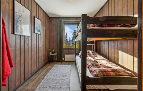 a bedroom with two bunk beds in a house at Amazing Apartment In Merker With Kitchen in Meråker