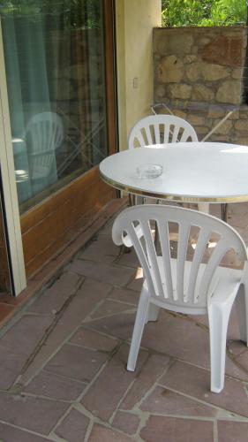 a white table and chairs on a patio at La Residence da Caterina in Vittorio Veneto