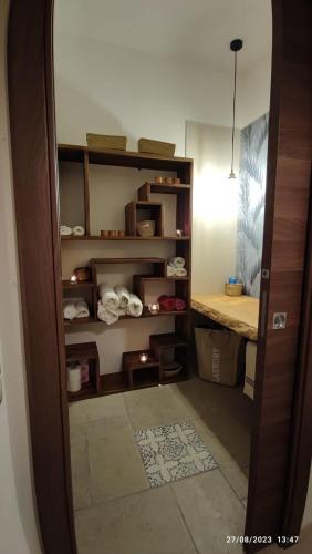 a room with a closet with shelves and a table at Villa Oasi dune e mare in Campobello di Mazara
