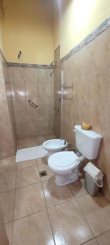 a bathroom with a toilet and a sink at La Sala Hotel Boutique in Tinogasta