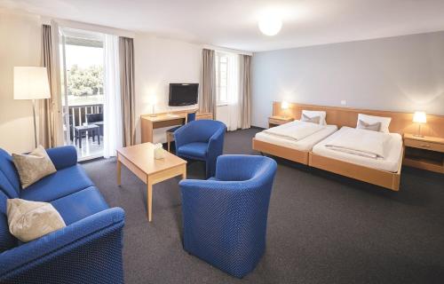 Postel nebo postele na pokoji v ubytování Hotel Schiff am Rhein