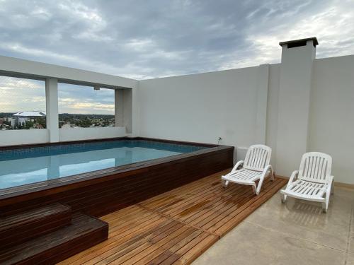Πισίνα στο ή κοντά στο Terrazas Resort departamento 1 dormitorio con piscina - cochera opcional