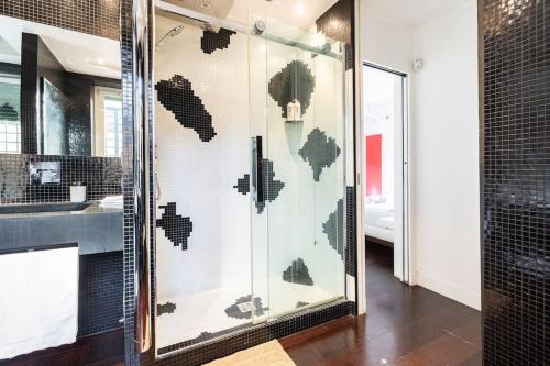 a glass shower in a bathroom with a sink at Luxury appartment 250mt for lovers in Rome