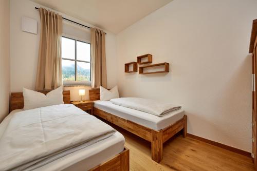 Postel nebo postele na pokoji v ubytování Alpinum