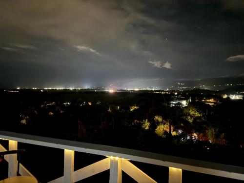 a view of a city at night at Hacienda Bella Vista in Limones