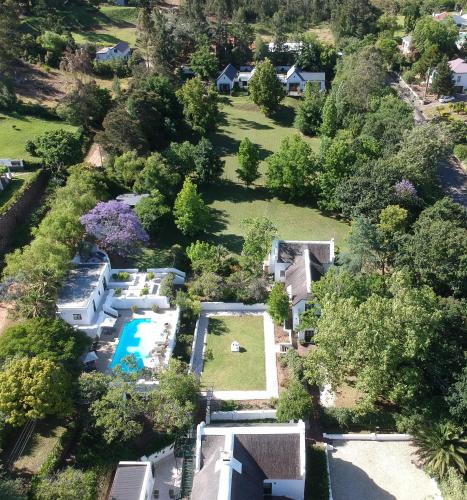 an aerial view of a house with a swimming pool at De Kloof Heritage Estate and Wellness in Swellendam