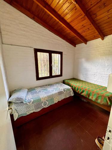 Katil atau katil-katil dalam bilik di Casa rustica en Chapadamalal