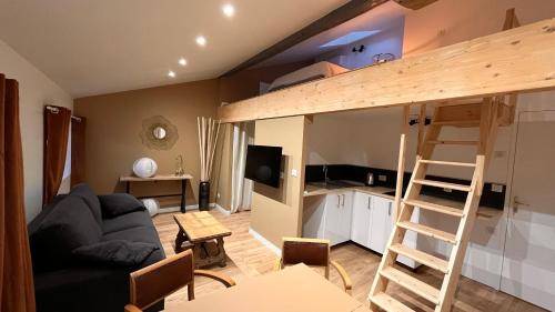 a living room with a couch and a loft bed at Résidence de l'houmeau - proche gare in Angoulême