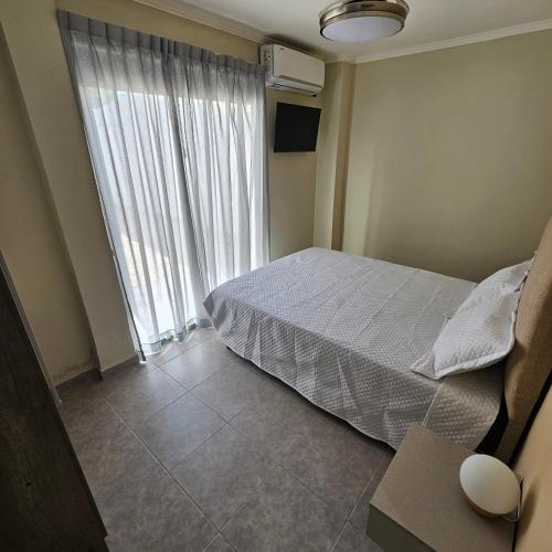 Ένα ή περισσότερα κρεβάτια σε δωμάτιο στο Brescia Apart Hotel