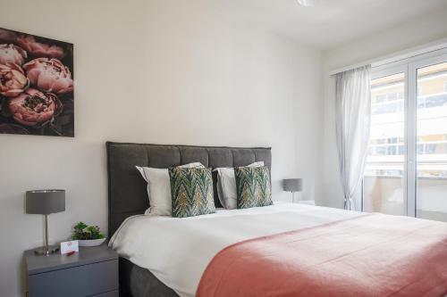 Postel nebo postele na pokoji v ubytování RELAX Ortensia Apartment