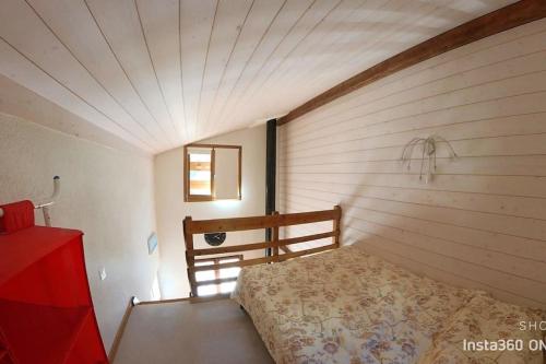 Giường trong phòng chung tại Stecaya Face à la piste de l'Aigle