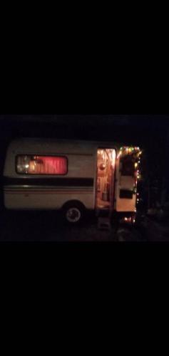 a fire truck with lights on the back of it at Caravan Hotel have TV & Netflix in Bangkok