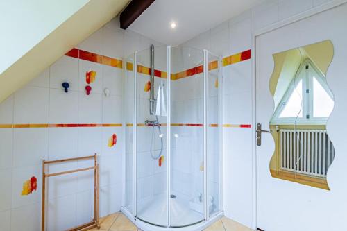 a white bathroom with a shower and a staircase at Charmante Maison au calme in Yerres