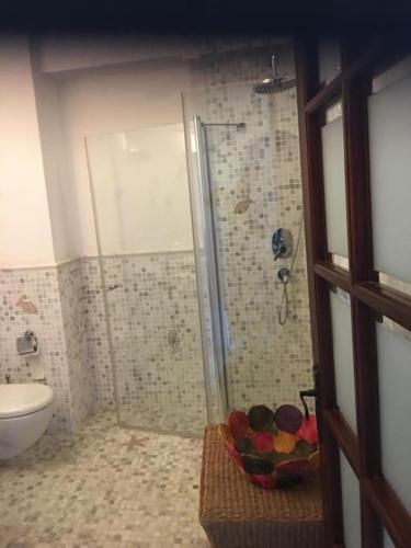 a bathroom with a shower and a bowl of food at Castle81homes Blue - Sea view house in Marmaris