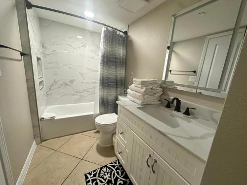 a bathroom with a sink and a toilet and a shower at Nautilus 1201 - Gulf Front 2 Bedroom Huge Wrap Around Balcony 2nd Floor! Free Beach Service 3/1-10/31 in Fort Walton Beach