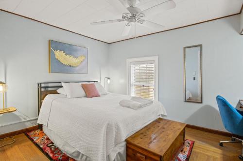 a bedroom with a bed and a ceiling fan at Walk To Parks, Dining & Lake! Game Room! Hot Tub! in Watkins Glen