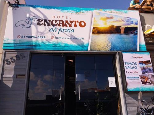 a sign for a hotel argento al paja on a building at Encanto da Praia hotel pousada in Natal