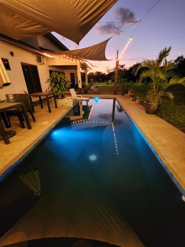 a swimming pool in a backyard at night at Catalina Cabins in Santa Catalina