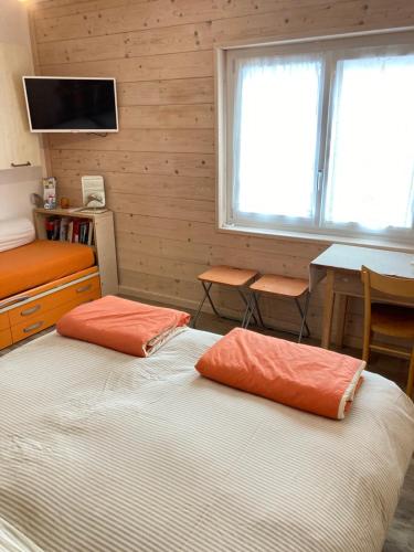 Tempat tidur dalam kamar di Pedibosco Orange