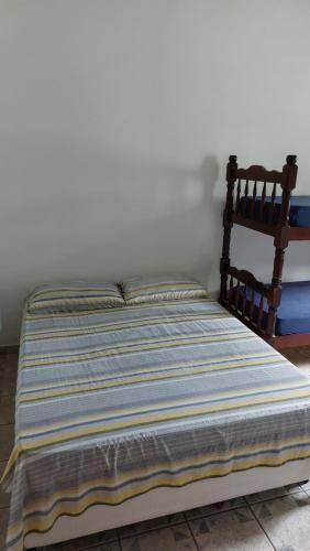 Postel nebo postele na pokoji v ubytování Maury Chalés Boiçucanga