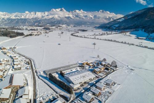 an aerial view of a ski resort in the snow at Sun Valley Apartments in Maishofen