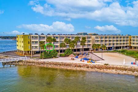 a hotel on the shore of a body of water at Oceans Pointe Nantucket inspired condo on the bay in Tampa