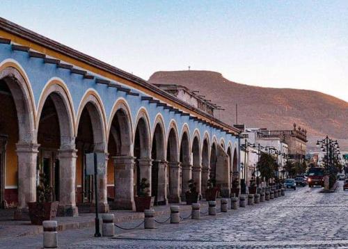 a building with arches on the side of a street at HOTEL SAN ROMAN in Sombrerete