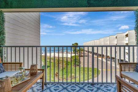 a balcony with a table and a view of a street at The Hemingway subtropical luxury on the Tampa Bay in Tampa