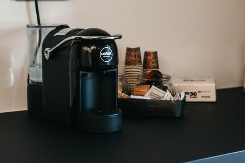 a coffee maker sitting on top of a counter at Gio Leo Guest House in Lesa