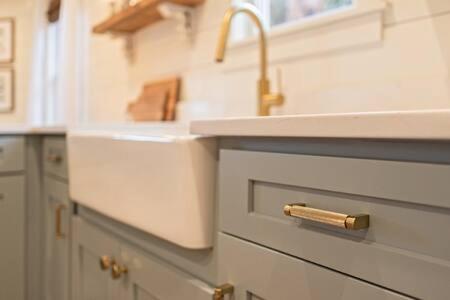 a kitchen with a sink and a counter top at Downtown Luxury Farmhouse Apartment #1 in West Dundee