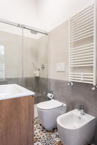 a bathroom with a sink and a toilet and a shower at Urban Nest Apartments in Milan
