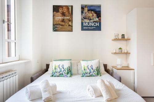 Giường trong phòng chung tại Urban Nest by Blue Velvet Livings