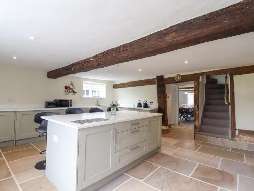 a kitchen with a white counter top in a room at West House Farm in Leiston