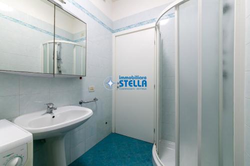 a bathroom with a sink and a shower at Residence Adriatica in Lido di Jesolo