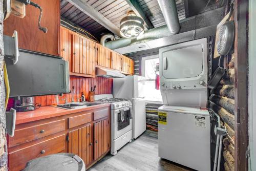 an rv kitchen with a stove and a refrigerator at Easy Interstate Access Original Poconos Log Cabin in Blakeslee