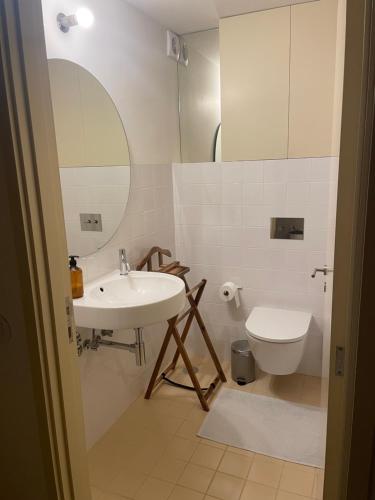 a bathroom with a sink and a toilet at Porto Siza Apartment in Porto