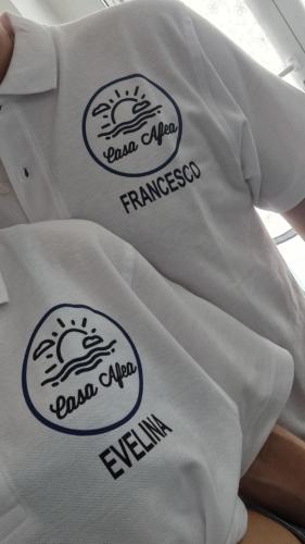 Casa Vacanze AFEA Torre dell'Orso Salento Pugliaに飾ってある許可証、賞状、看板またはその他の書類