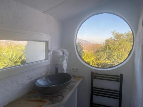 a bathroom with a sink and a large window at La Careza De Mijas - Adults Only in Mijas