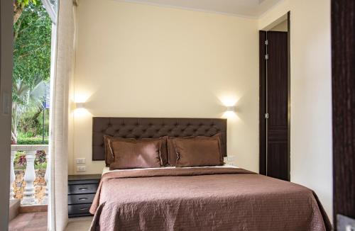 Hotel Posada Campestre San Gilにあるベッド