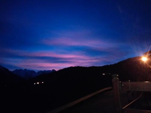 a night view of a mountain with a street light at Grand Rive in Saint-Pierre