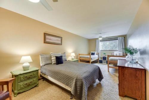 a bedroom with a bed and a desk in a room at Fern Hill Retreat in Chehalis